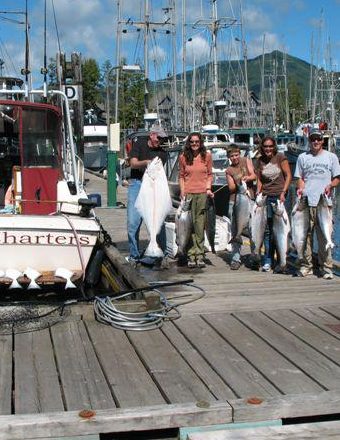 Family on dock returning from fishing package